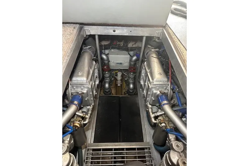 Slide: The Image of Engine room of 1989 Viking 41 Sportfish Convertible boat, showcasing mechanical components. - 45