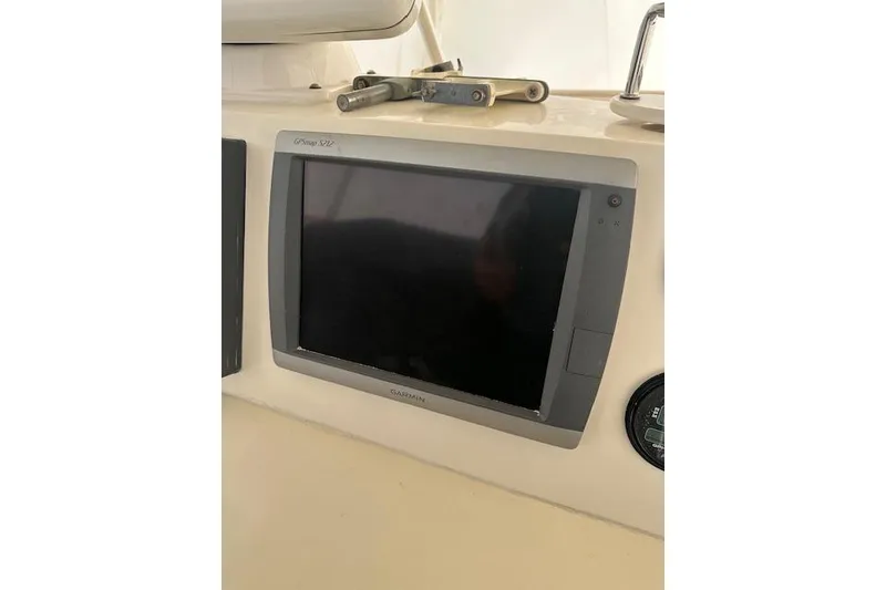 Slide: The Image of Garmin GPS display on 1989 Viking 41 Sportfish Convertible boat dashboard. - 47