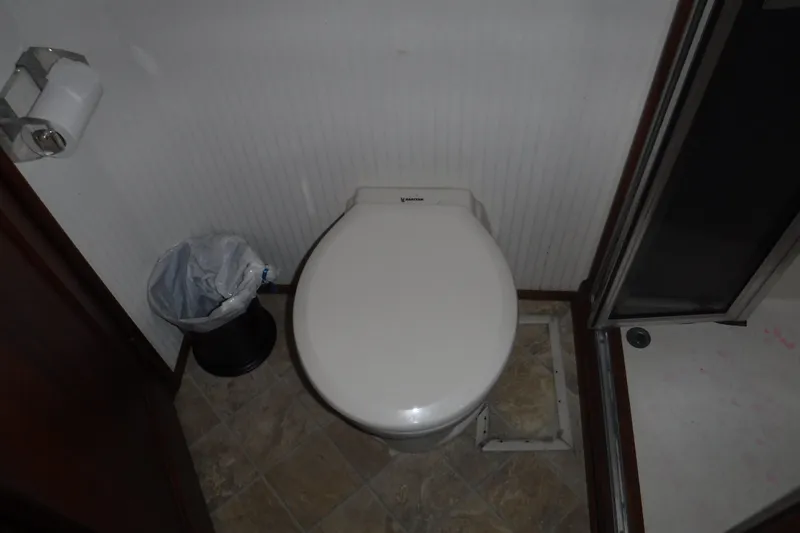 Slide: The Image of Toilet area in 1989 Viking 41 Sportfish Convertible boat bathroom. - 52