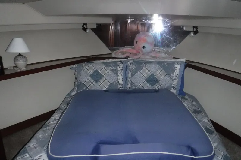 Slide: The Image of Cozy bedroom in 1989 Viking 41 Sportfish Convertible yacht with plush octopus decor. - 53