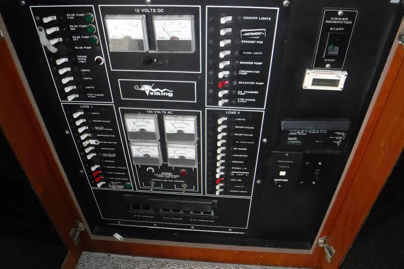 Slide: The Image of Electrical control panel of a 1989 Viking 41 Sportfish Convertible boat. - 54