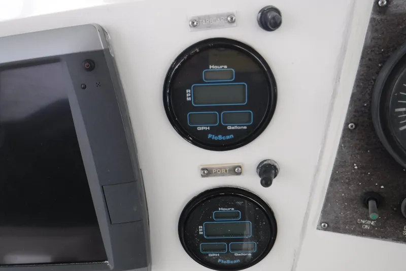 Slide: The Image of Control panel of a 1989 Viking 41 Sportfish Convertible with FloScan gauges. - 56