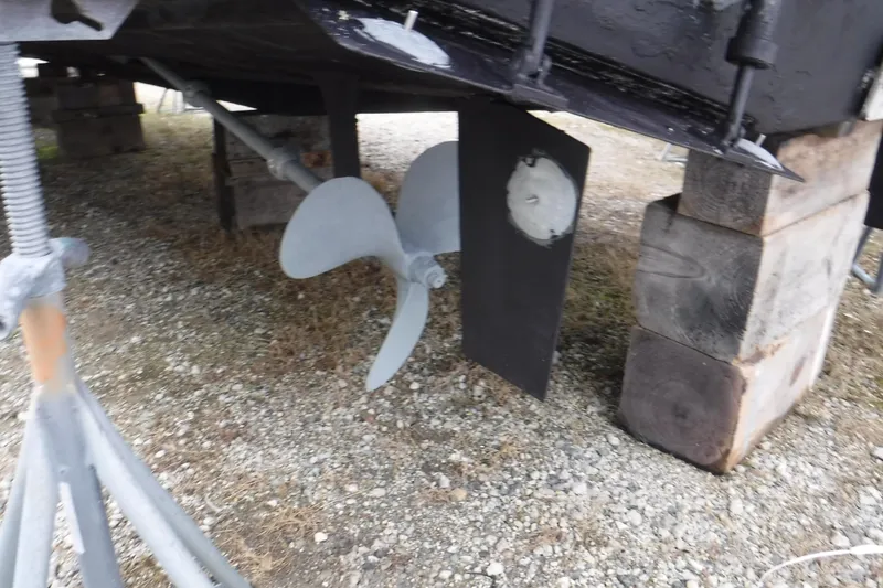 Slide: The Image of 1989 Viking 41 Sportfish Convertible propeller and rudder on dry dock. - 59