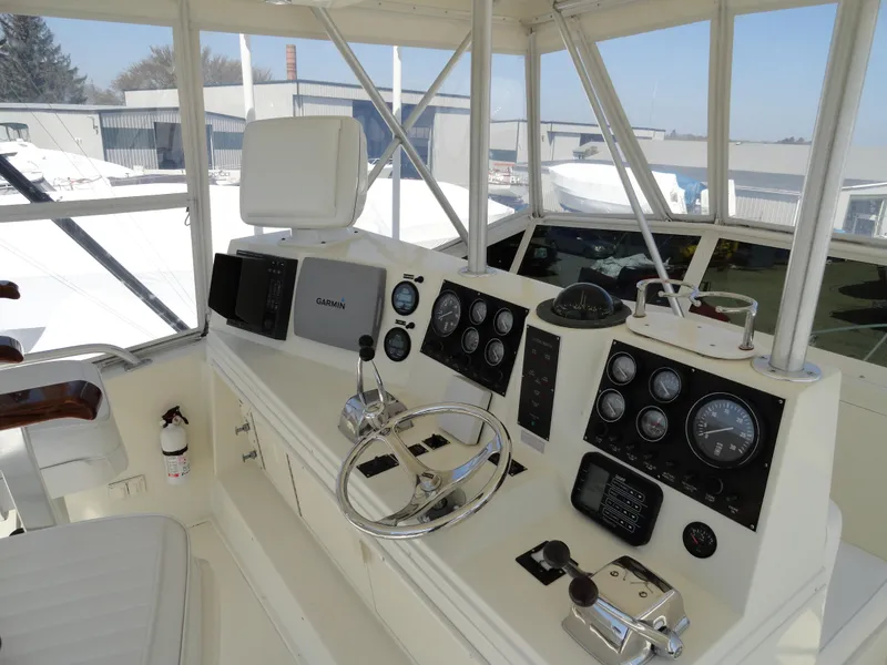 Slide: The Image of 1989 Viking 41 Sportfish Convertible helm with instruments. - 6