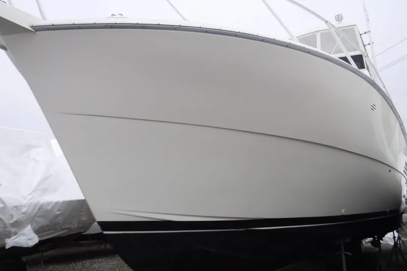 Slide: The Image of 1989 Viking 41 Sportfish Convertible boat, side view, on dry dock. - 61