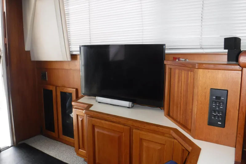 Slide: The Image of Interior of 1989 Viking 41 Sportfish Convertible with TV and wooden cabinetry. - 67