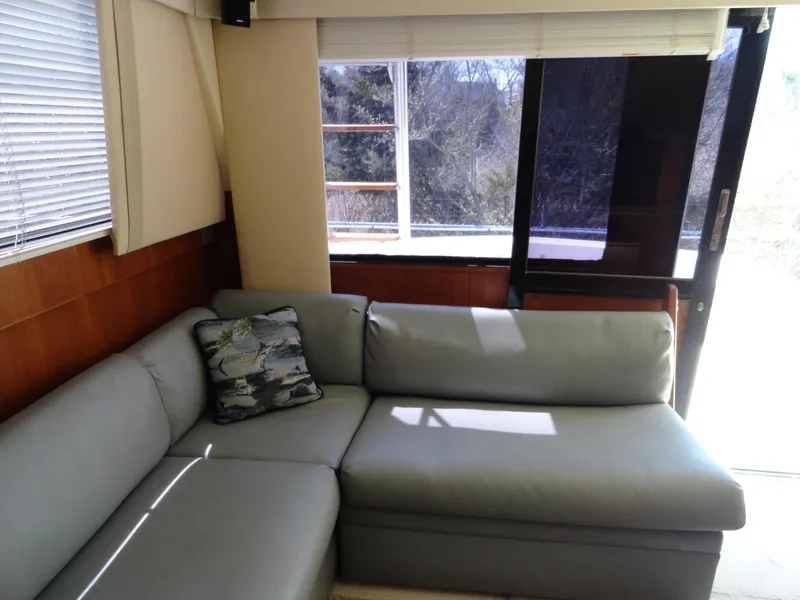 Slide: The Image of Interior of 1989 Viking 41 Sportfish Convertible with gray sofa. - 8