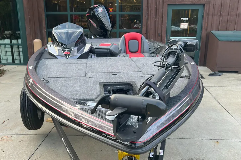 Slide: The Image of 2024 Ranger Z519 Ranger Cup Equipped fishing boat, front view, parked on concrete. - 2