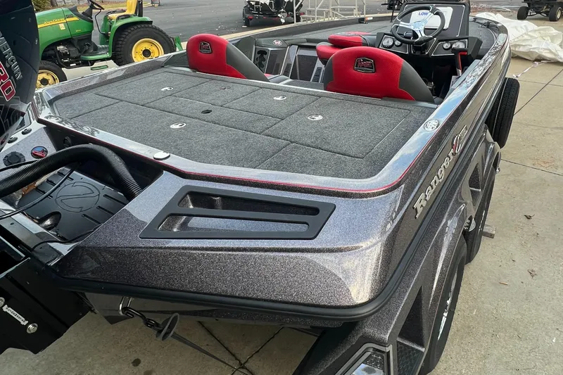Slide: The Image of 2024 Ranger Z519 Ranger Cup Equipped boat with red seats and spacious deck. - 3