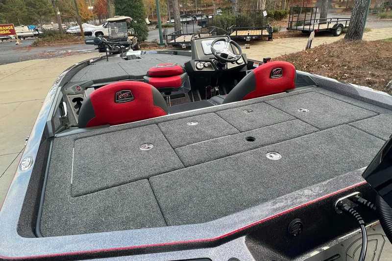 Slide: The Image of 2024 Ranger Z519 Ranger Cup Equipped boat with red seats and ample storage. - 6