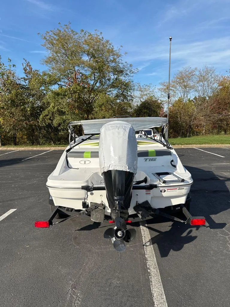 Slide: The Image of 2024 Tahoe T16 boat in parking lot, rear view, with outboard motor. - 3