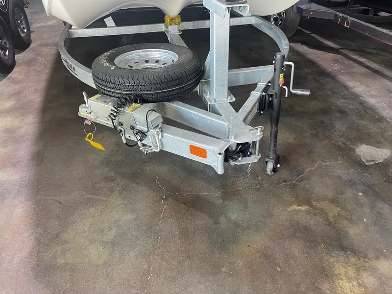 Slide: The Image of 2024 Mako Pro Skiff 19 CC trailer hitch with spare tire. - 8