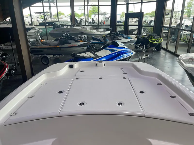 Slide: The Image of 2024 Mako Pro Skiff 19 CC boat on display in showroom. - 9
