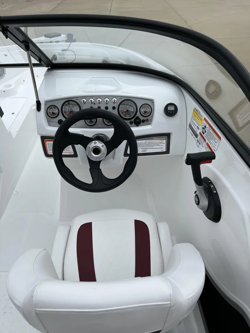 Slide: The Image of 2024 Tahoe 185 S boat cockpit with steering wheel and control panel. - 5