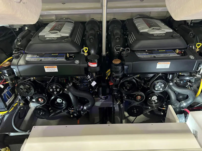 Slide: The Image of 2024 Crownline E305 boat engine compartment with dual 350 HP engines. - 7