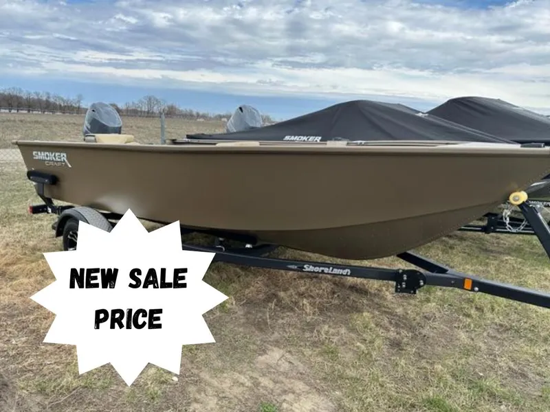 The Image of 2024 Starcraft Freedom 160TL boat on trailer with new sale price sign. - 0