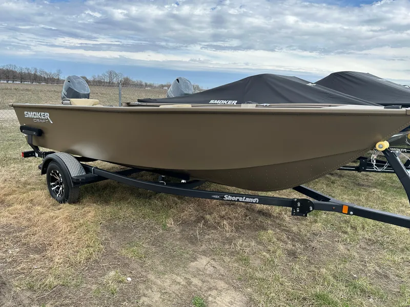 Slide: The Image of 2024 Starcraft Freedom 160TL boat on a trailer in an outdoor setting. - 1