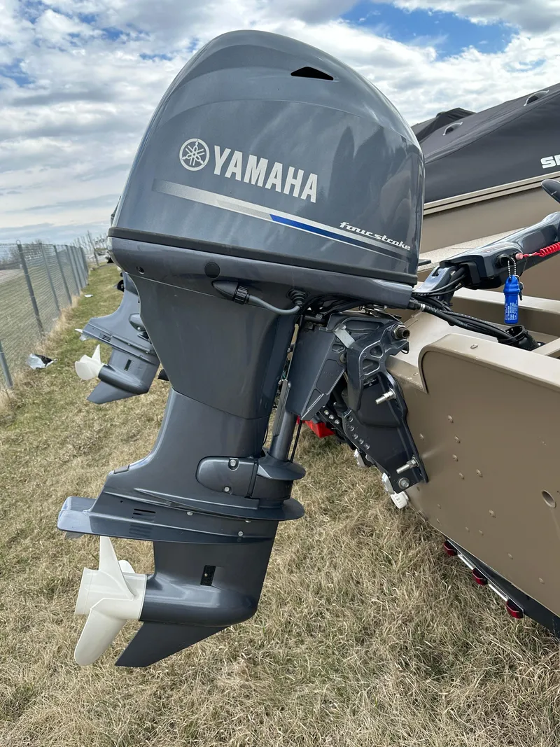 Slide: The Image of 2024 Starcraft Freedom 160TL with Yamaha outboard motor. - 2