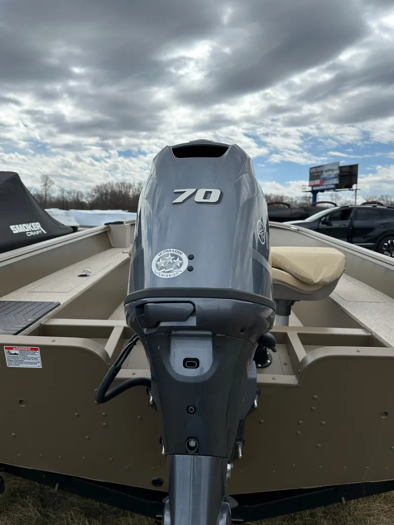 Slide: The Image of 2024 Starcraft Freedom 160TL boat with a 70 HP outboard motor. - 3