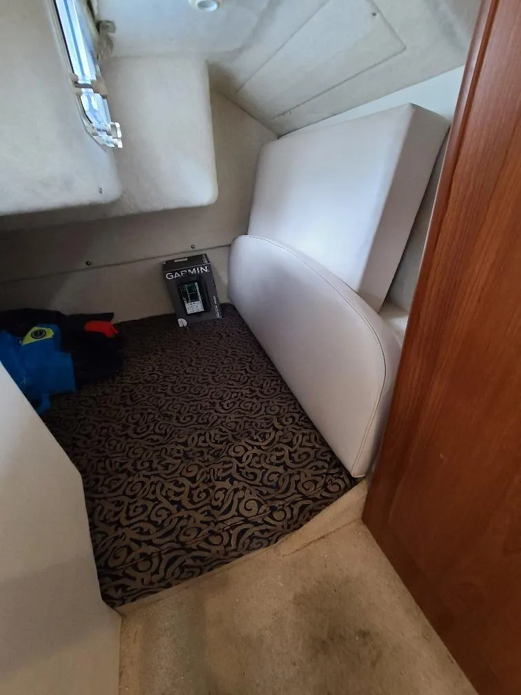 Slide: The Image of Interior cabin of 2003 Bayliner 285 Ciera with patterned carpet and cushions. - 13