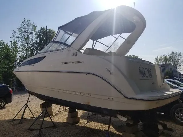 Slide: The Image of 2003 Bayliner 285 Ciera boat on stands, outdoor setting, side view. - 24