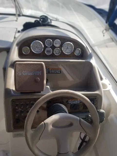 Slide: The Image of Dashboard of a 2003 Bayliner 285 Ciera boat with steering wheel and gauges. - 28