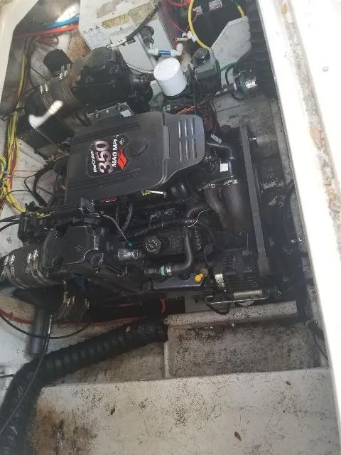 Slide: The Image of Engine compartment of a 2003 Bayliner 285 Ciera boat, featuring a MerCruiser 350 engine. - 29
