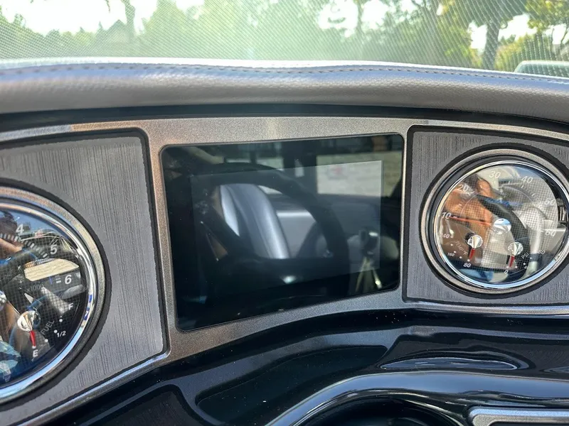 Slide: The Image of 2024 Sanger V215 SX dashboard with digital display and analog gauges. - 15
