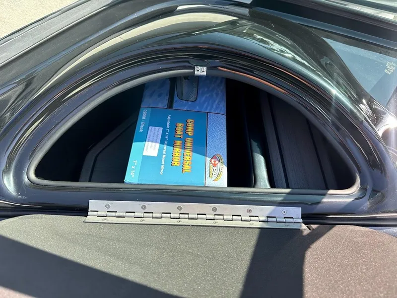Slide: The Image of 2024 Sanger V215 SX storage compartment with a blue box inside. - 19