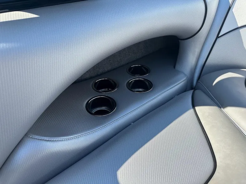 Slide: The Image of 2024 Sanger V215 SX boat interior with built-in cup holders. - 21