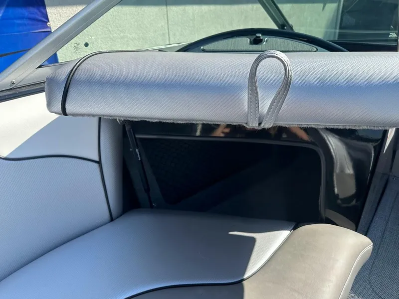 Slide: The Image of Interior of 2024 Sanger V215 SX boat with gray and black seating. - 26