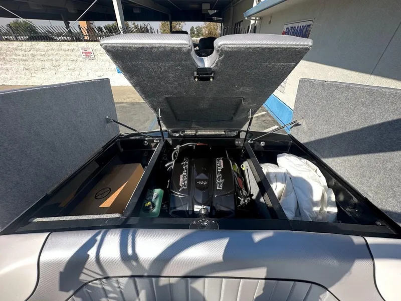 Slide: The Image of 2024 Sanger V215 SX boat engine compartment with open hatches. - 30