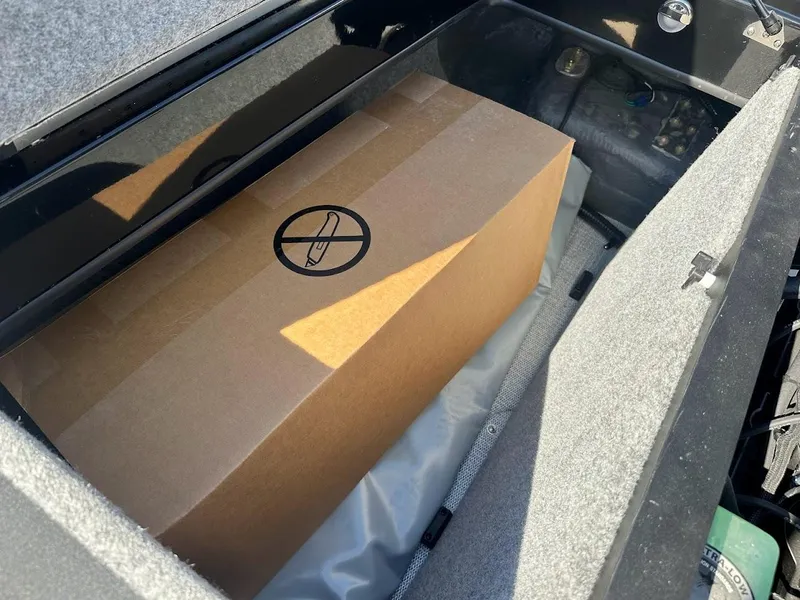 Slide: The Image of Storage compartment of 2024 Sanger V215 SX with a cardboard box inside. - 32