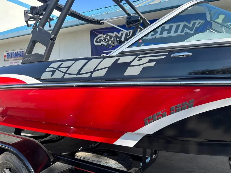 Slide: The Image of 2024 Sanger V215 SX boat with Surf decal, red and black color scheme. - 37