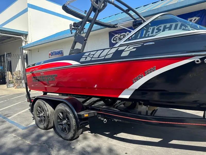Slide: The Image of 2024 Sanger V215 SX red and black boat on a trailer. - 4