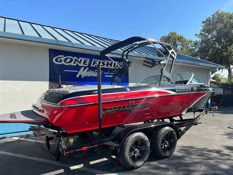 Slide: The Image of 2024 Sanger V215 SX red boat on trailer at dealership. - 5