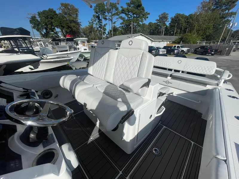 Slide: The Image of 2020 Fountain 38 Center Console boat with white seating and steering wheel. - 21