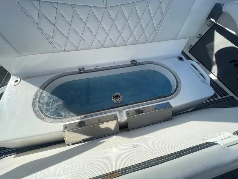 Slide: The Image of 2020 Fountain 38 Center Console livewell with cushioned seating. - 23