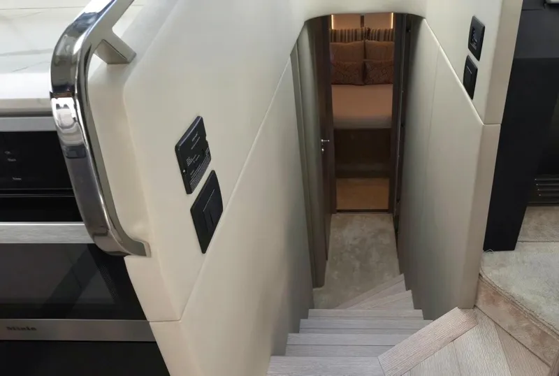 Slide: The Image of Staircase leading to cabin interior of 2021 Azimut S6 Sports Fly yacht. - 19