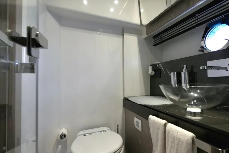 Slide: The Image of Luxurious bathroom in 2021 Azimut S6 Sports Fly yacht with modern fixtures and glass sink. - 23