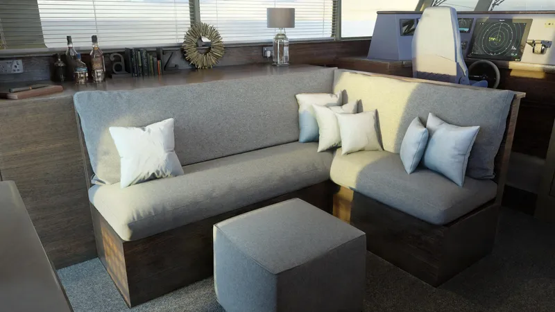 Slide: The Image of Modern interior of Archipelago 47 yacht, 2025 model, featuring a cozy seating area with cushions. - 11