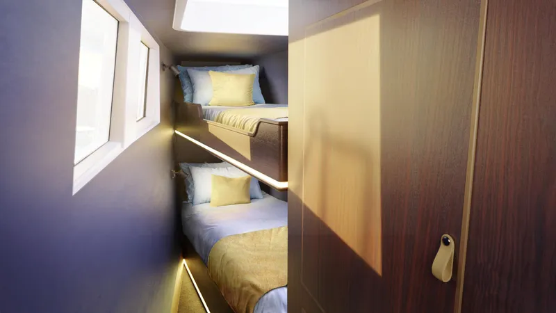 Slide: The Image of 2025 Archipelago 47 yacht interior with modern bunk beds and cozy lighting. - 16