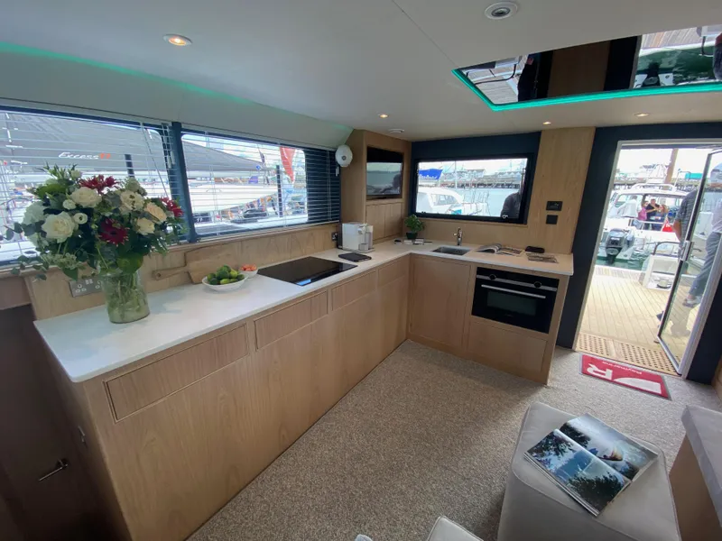 Slide: The Image of Modern kitchen interior of Archipelago 47 yacht, 2025 model, with sleek design and ample natural light. - 17