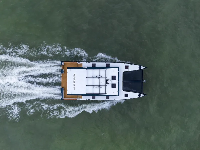 Slide: The Image of Aerial view of 2025 Archipelago 47 boat cruising on water. - 3