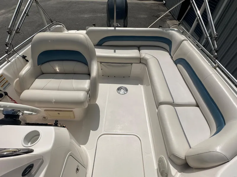 Slide: The Image of 2007 Hurricane 201 FUNDECK c boat interior with white and blue seating. - 6