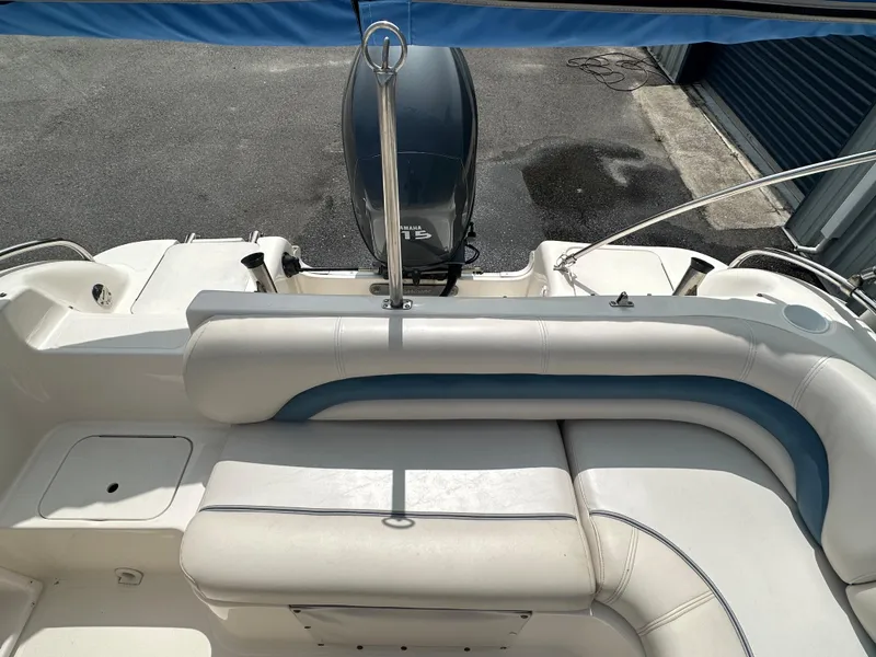 Slide: The Image of 2007 Hurricane 201 FUNDECK c boat with cushioned seating and outboard motor. - 7