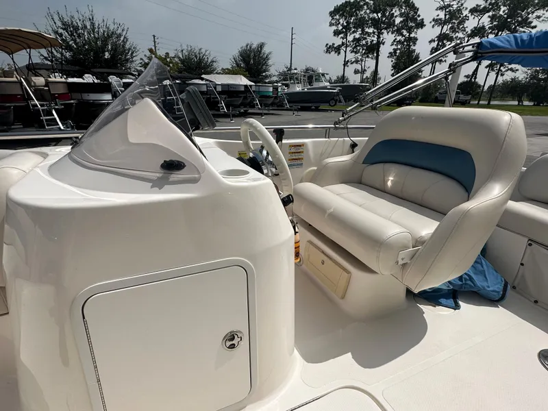 Slide: The Image of 2007 Hurricane 201 FUNDECK c boat interior with steering console and seating. - 12