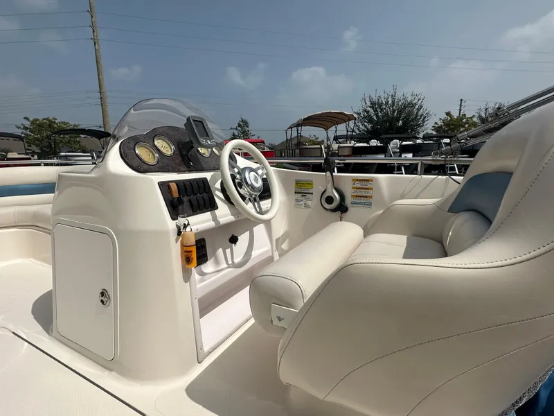 Slide: The Image of 2007 Hurricane 201 FUNDECK c boat interior with steering console and seating. - 13