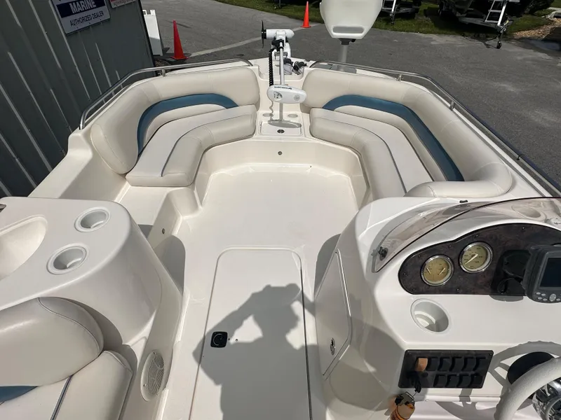 Slide: The Image of 2007 Hurricane 201 FUNDECK c boat interior with spacious seating and control panel. - 9