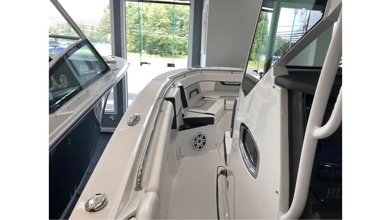 Slide: The Image of 2024 Blackfin 272 CC boat interior with seating and speaker system. - 13